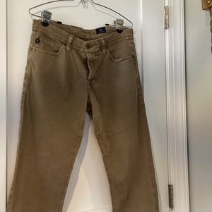 AG  The Graduate tailored leg Khaki colored straight jeans. 5 pocket